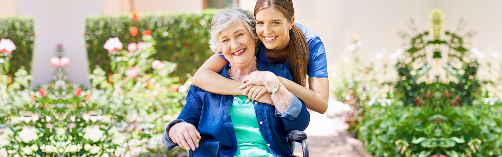caregiver hugging the elderly